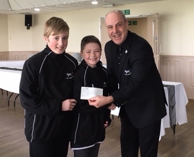 Under 12's presenting cheque