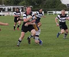 Karl Thompson drives for the line